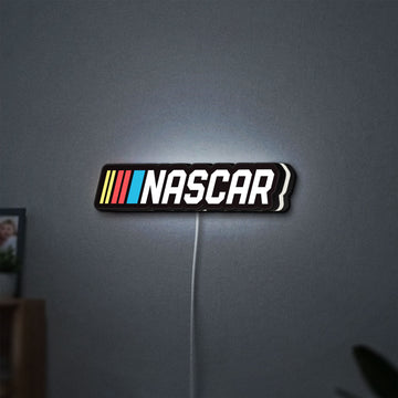 NASCAR LED lightbox hanging on a wall with white glow