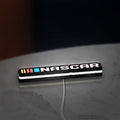 NASCAR LED lightbox lying flat on a desk with white glow