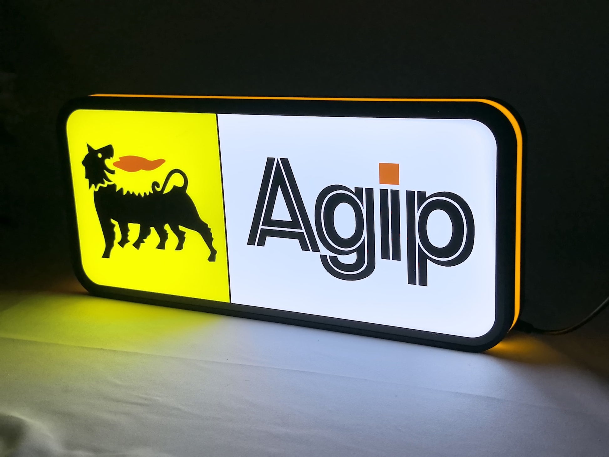 Illuminated angled view standing of Agip Six Legged Dog Illuminated Sign in 40cm, unique wall art for desk and room decor