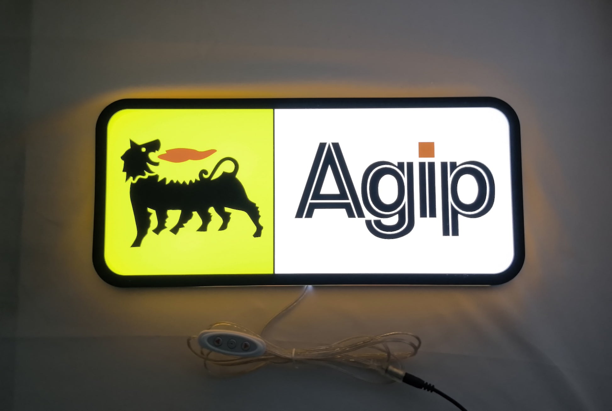 Agip Six Legged Dog LED Sign (40cm) - Illuminated flat lay front view, unique wall art for desk and room decor