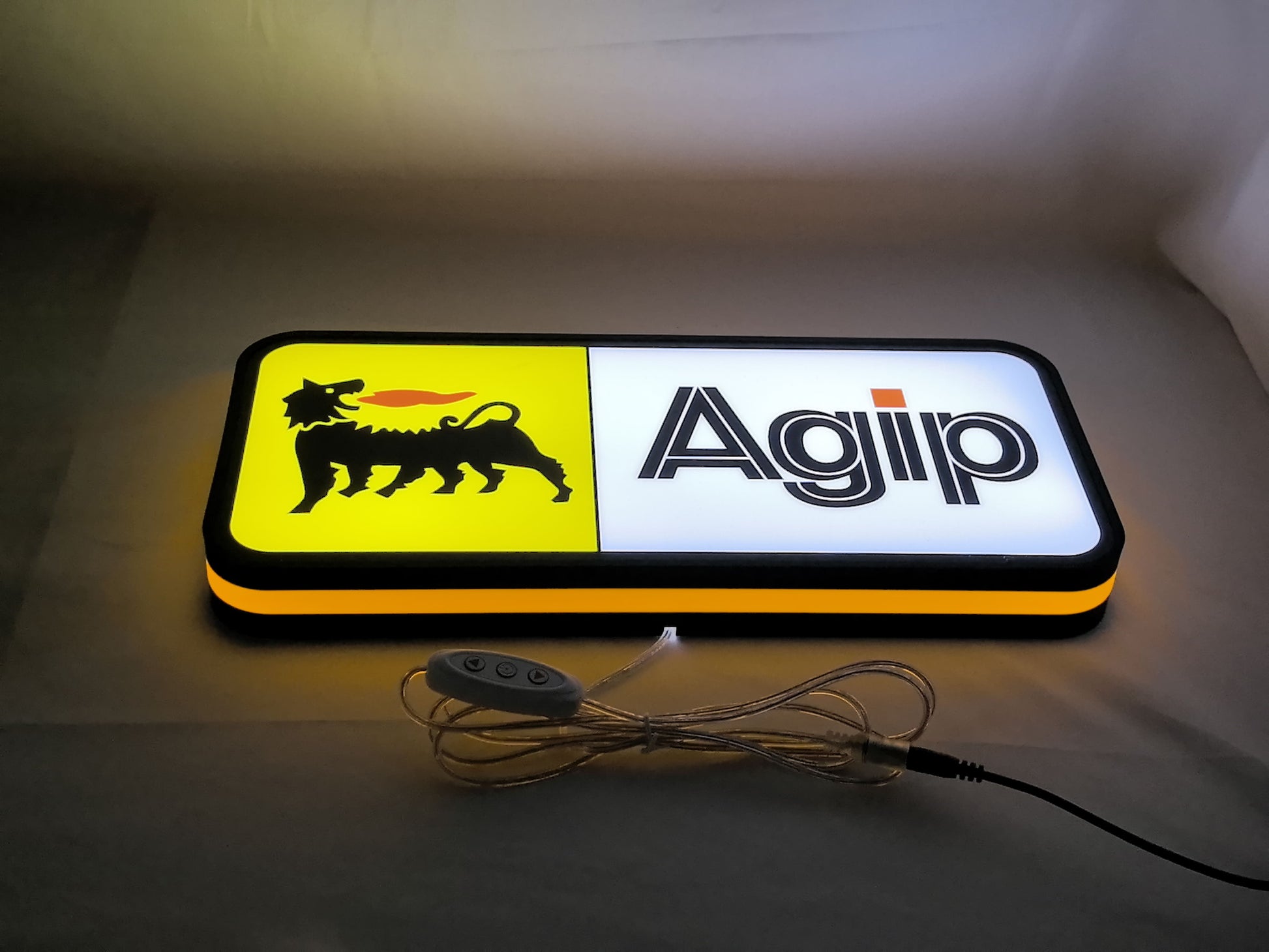 40cm Agip Six Legged Dog 3D Printed Sign - Illuminated flat lay angled view, unique wall art for desk and room decor