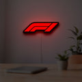 F1 2021 LED lightbox hanging on a room wall with soft red light