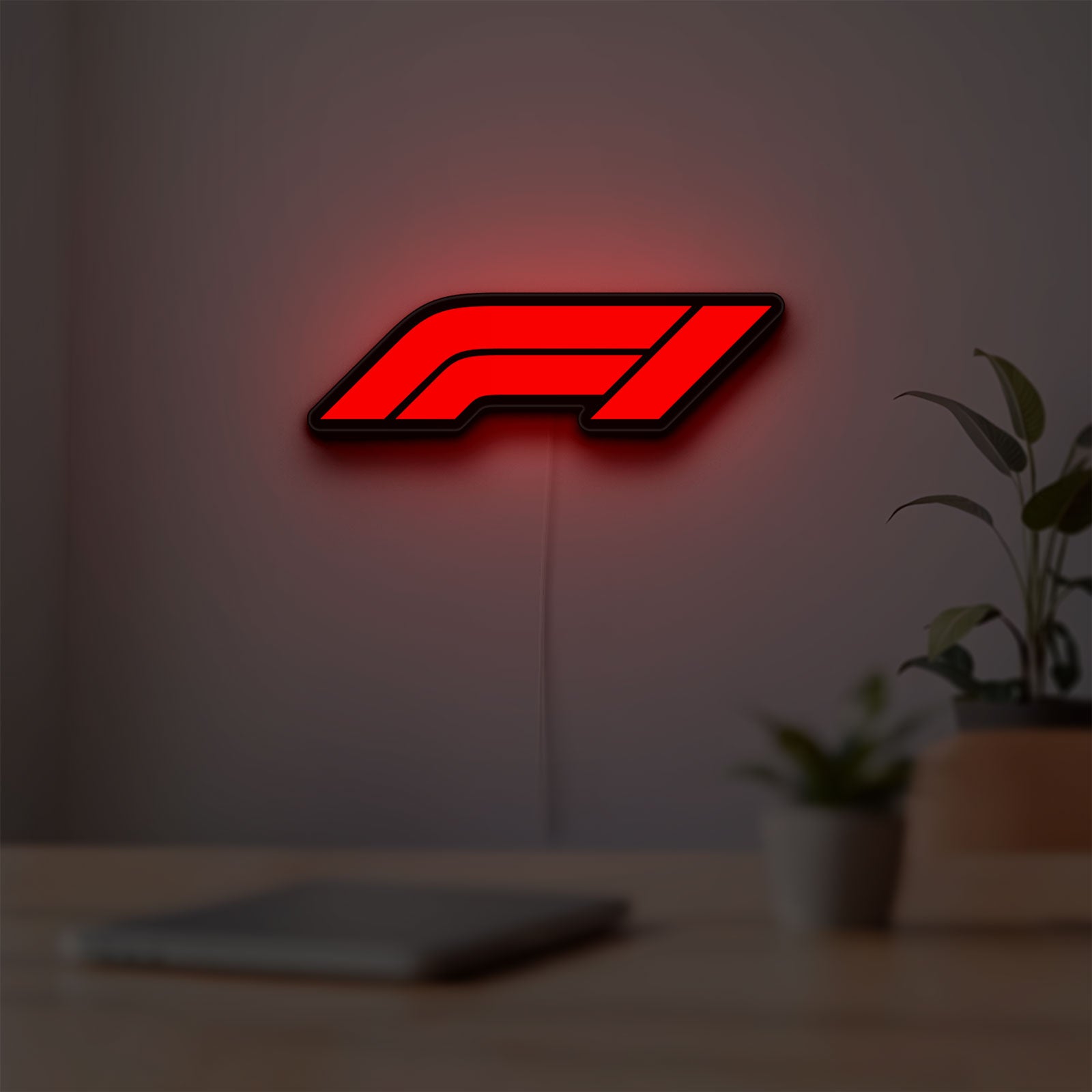 F1 2021 LED lightbox hanging on a room wall with soft red light