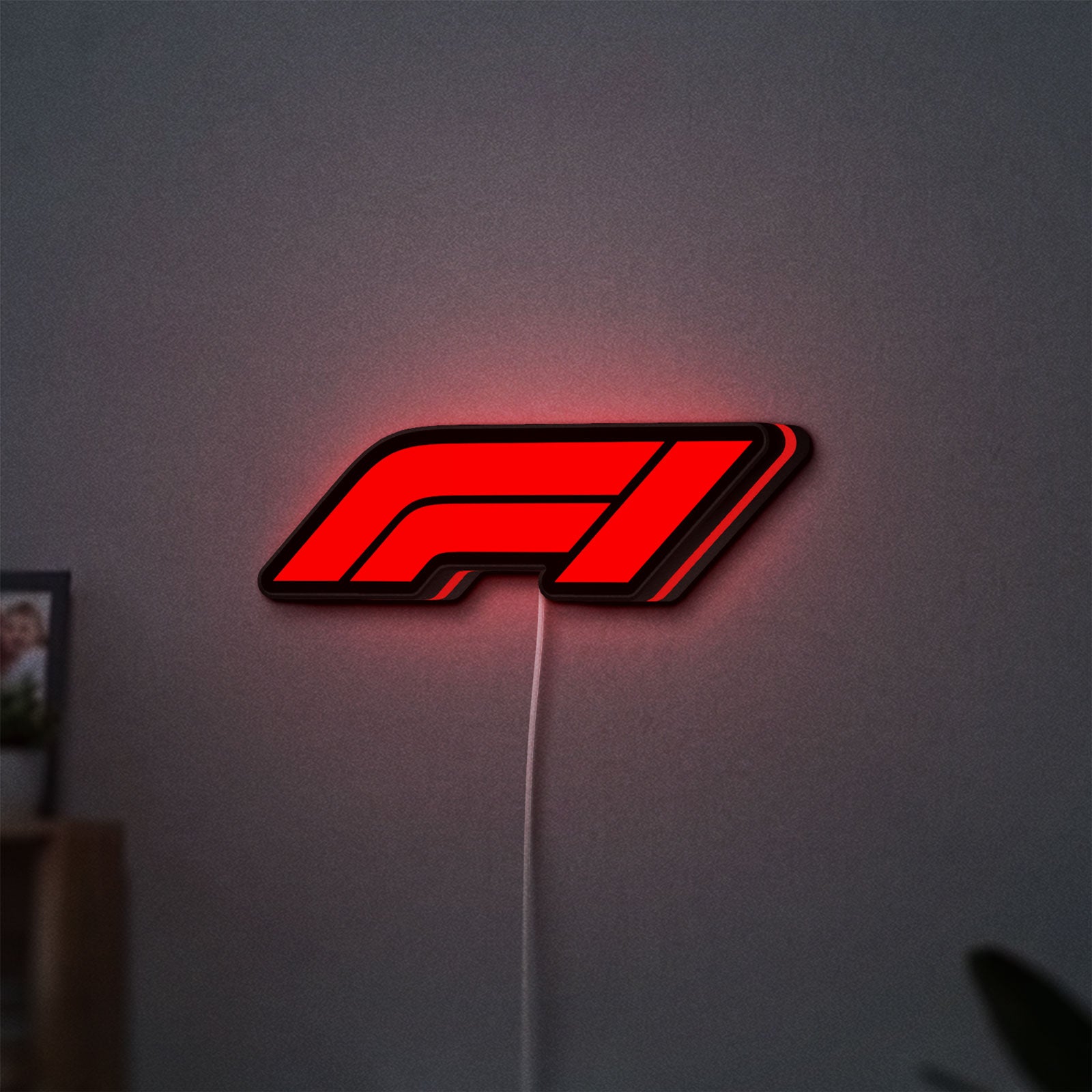 F1 2021 LED lightbox hanging on a wall with red glow
