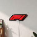 Unlit F1 2021 LED lightbox mounted on a wall in daylight