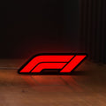 Front view of F1 2021 LED lightbox sign glowing on a wooden desk