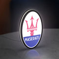 Maserati LED lightbox standing on a desk from an angled side view with white glow