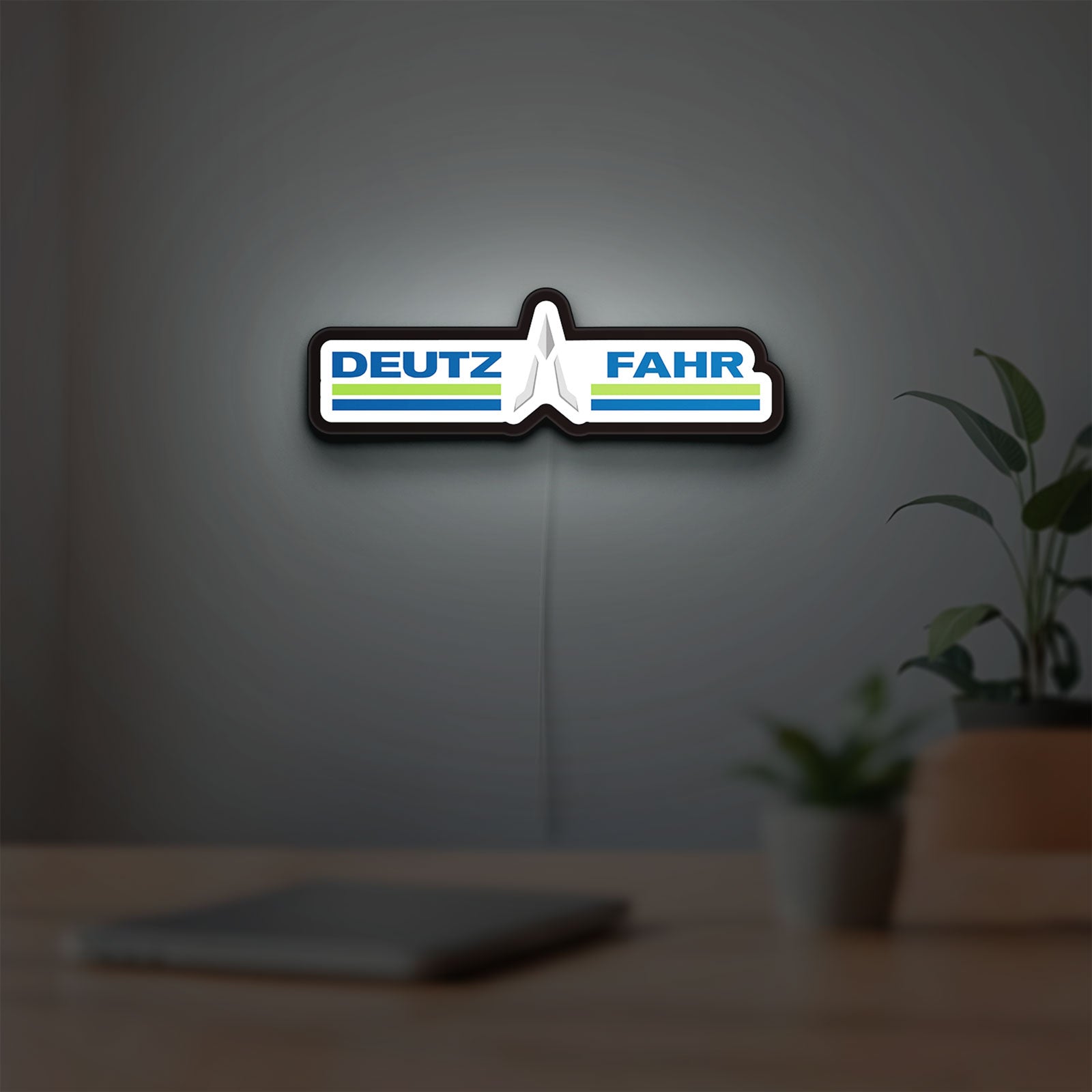 DEUTZ FAHR LED lightbox hanging on a room wall with soft white light