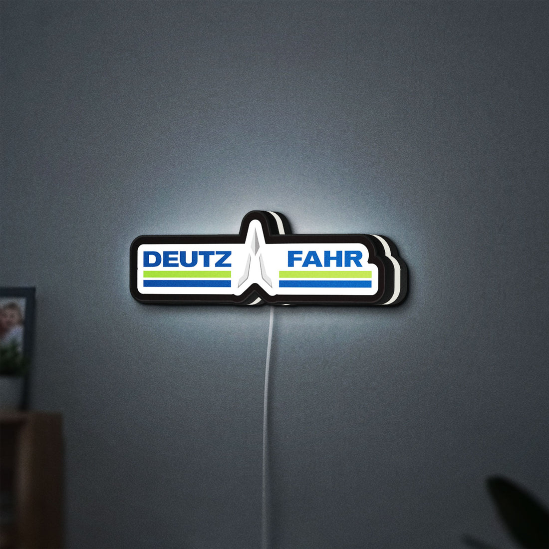 DEUTZ FAHR LED lightbox hanging on a wall with white glow