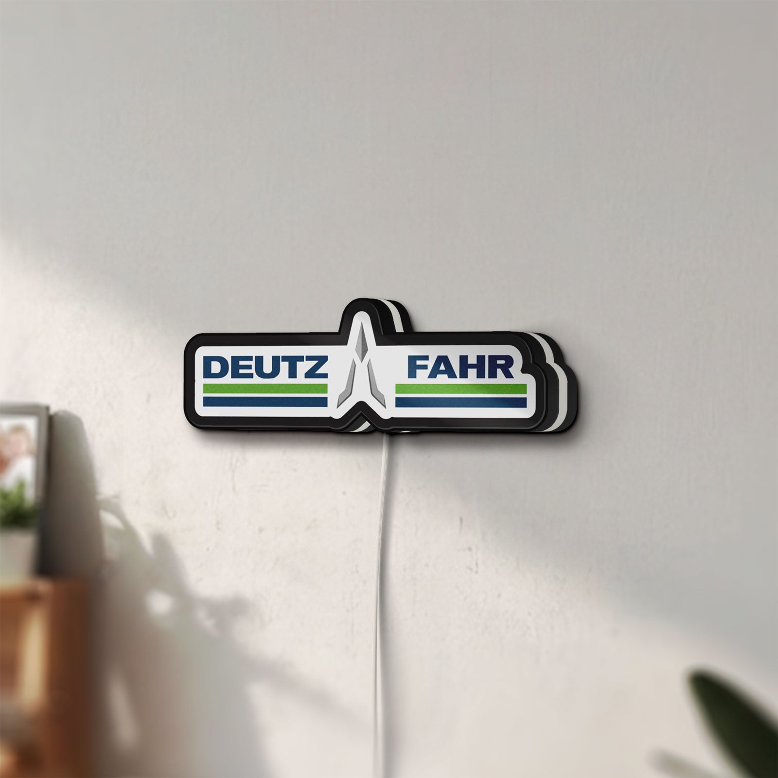 Unlit DEUTZ FAHR LED lightbox mounted on a wall in daylight