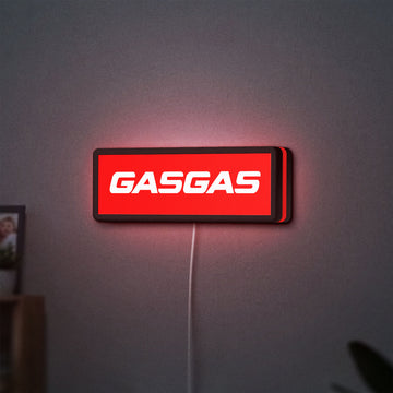 GasGas LED lightbox hanging on a wall with red glow