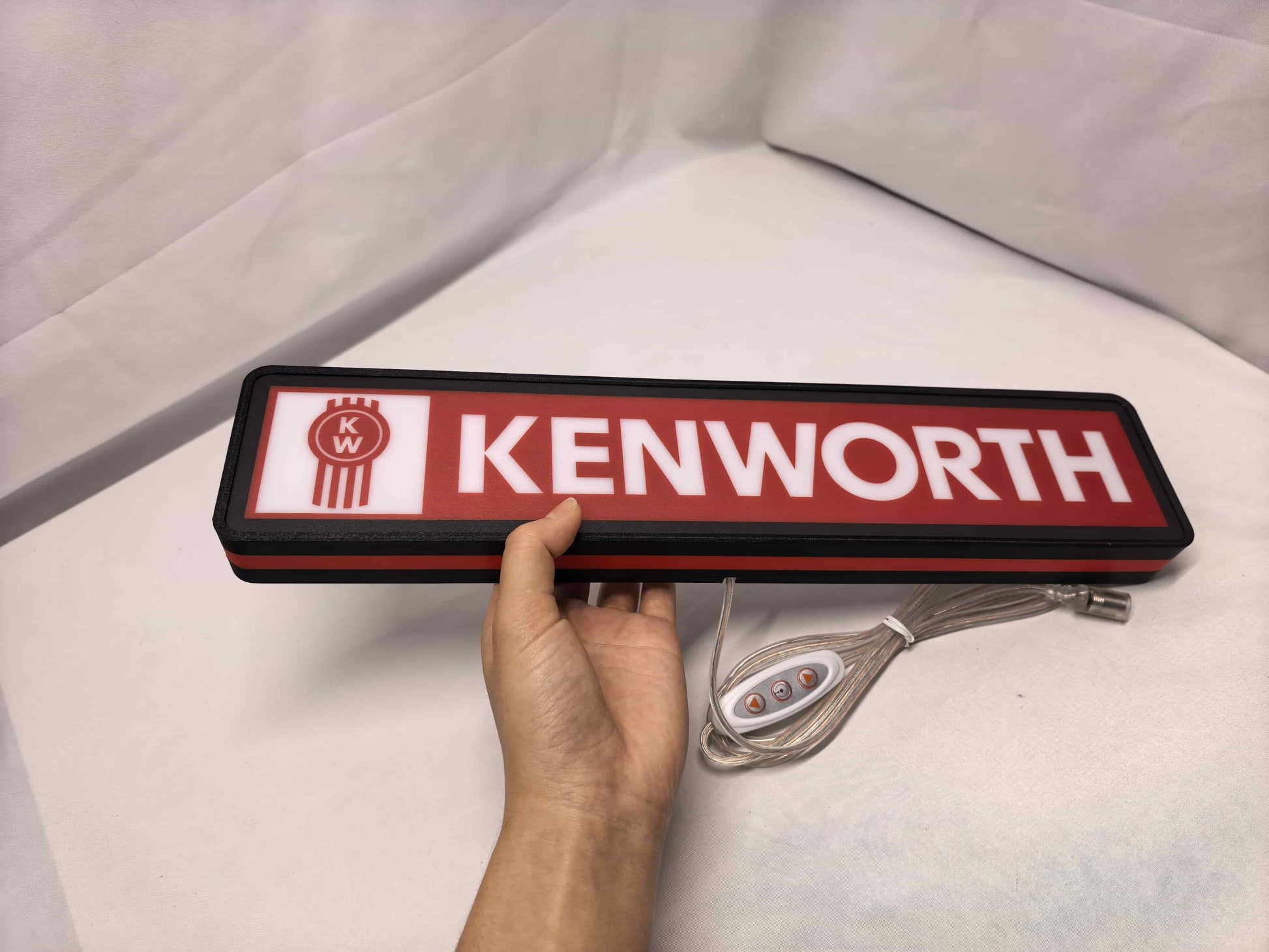 40cm Kenworth Glowing Wall Art - Unlit handheld size reference, perfect for garage and man cave decor