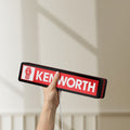Unlit Kenworth LED lightbox held by hand to show size and details