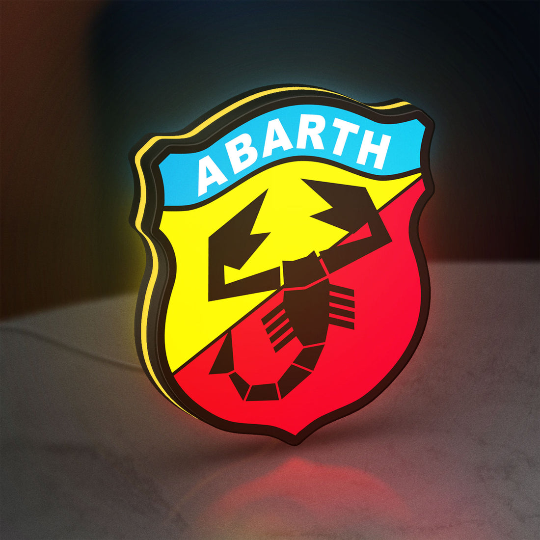 Abarth Scorpion LED lightbox hanging on a wall with yellow glow