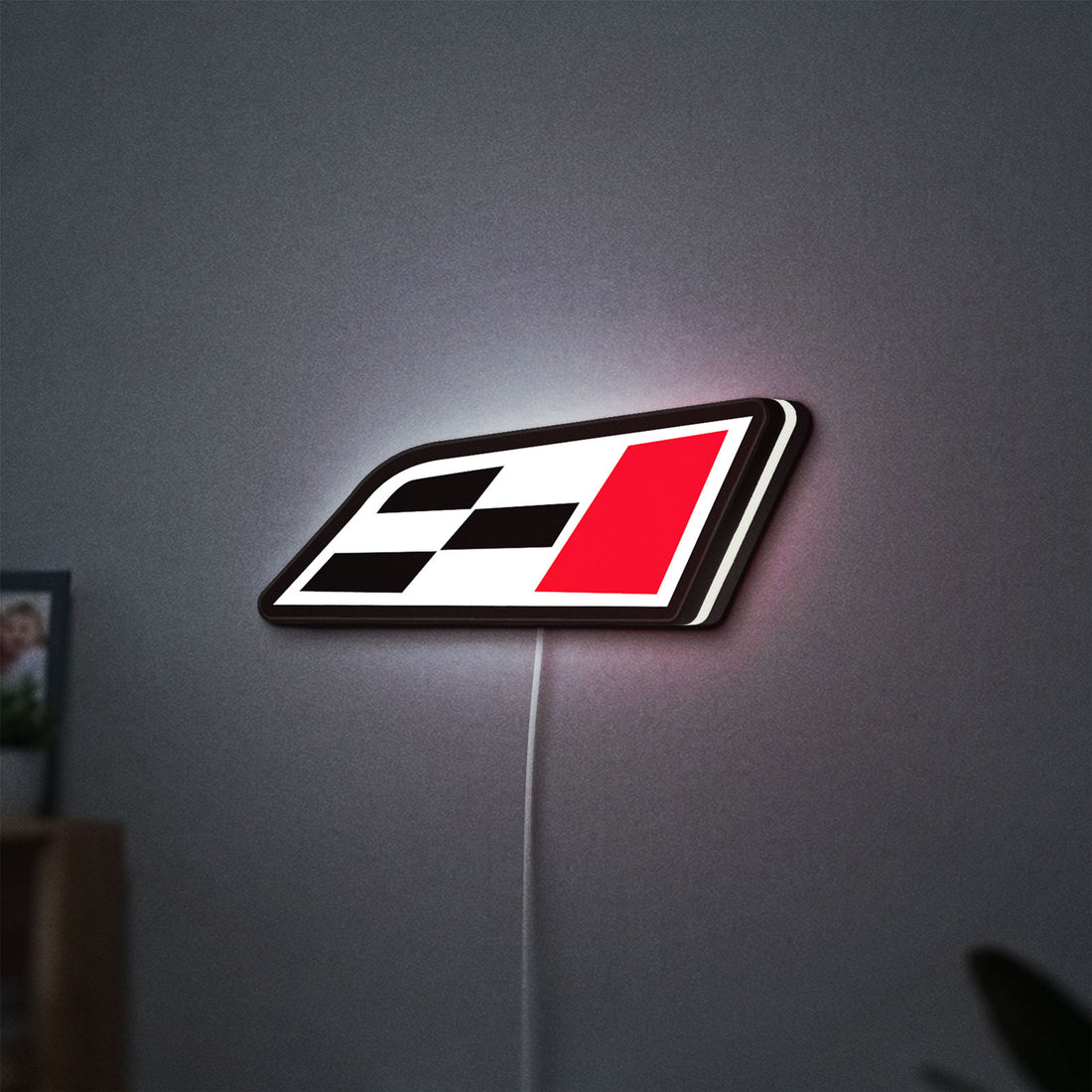 Cupra Racing Flag LED lightbox hanging on a wall with white glow