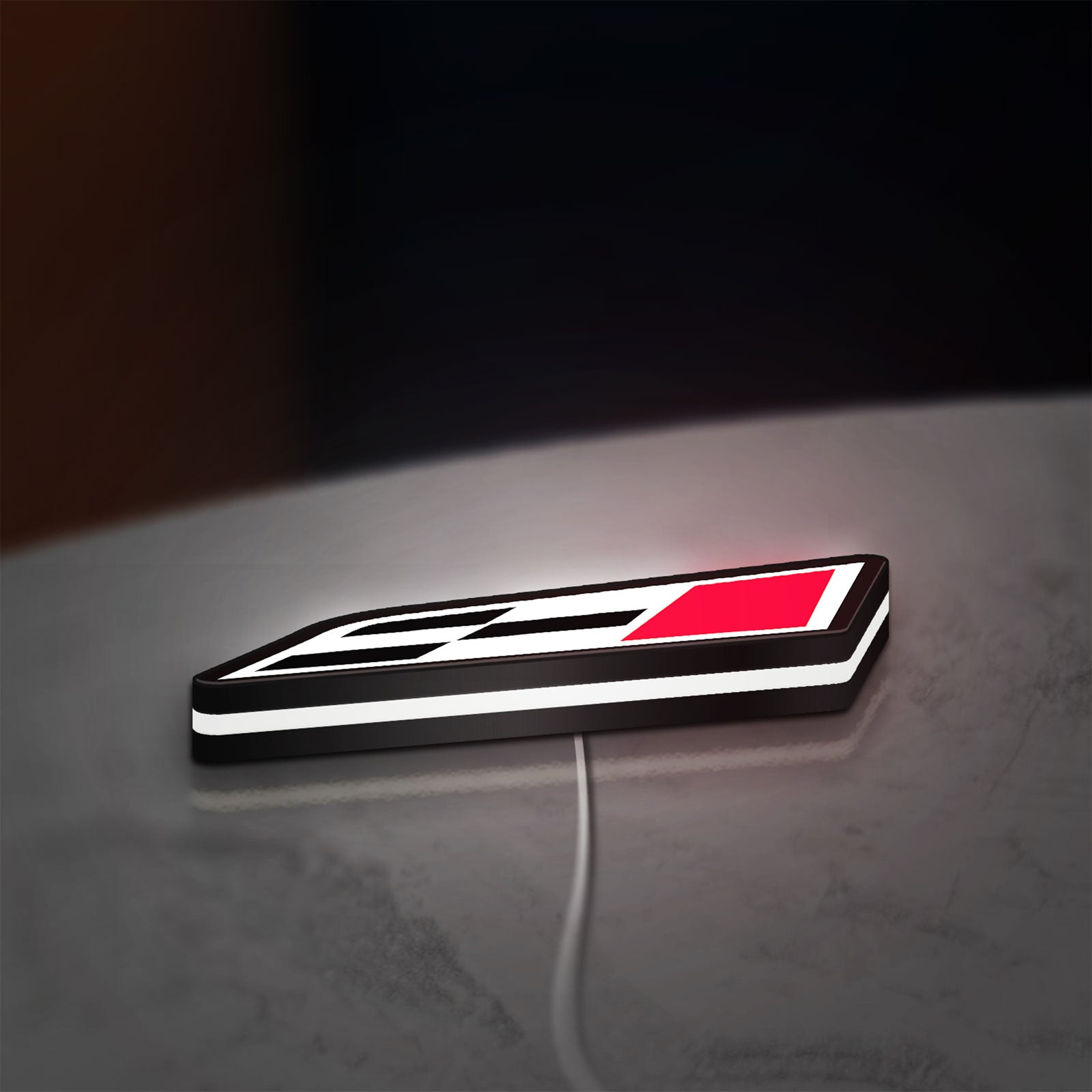 Cupra Racing Flag LED lightbox lying flat on a desk with white glow
