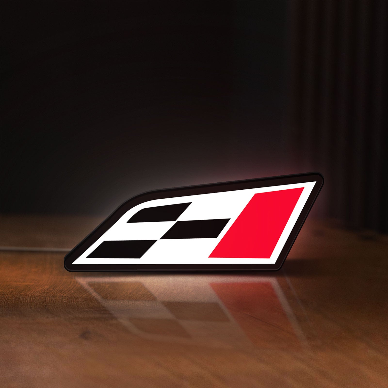 Front view of Cupra Racing Flag LED lightbox sign glowing on a wooden desk