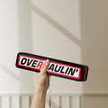 Unlit Overhaulin LED lightbox held by hand to show size and details