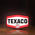 Front view of Texaco LED lightbox sign glowing on a wooden desk
