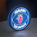 SAAB Scania LED lightbox standing on a desk from an angled side view with blue glow