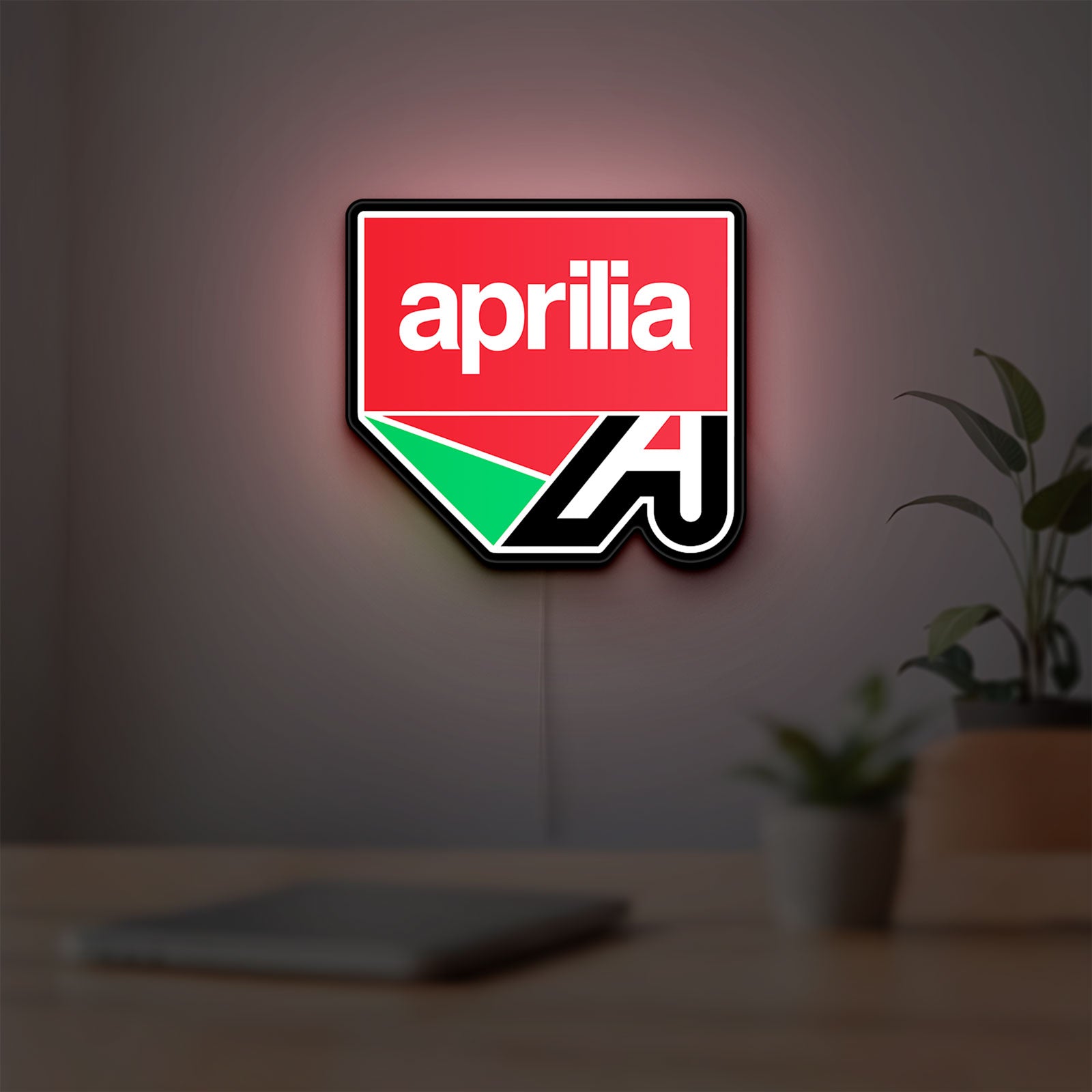 Aprilia LED lightbox hanging on a room wall with soft red light