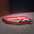 Aprilia LED lightbox lying flat on a desk with red glow