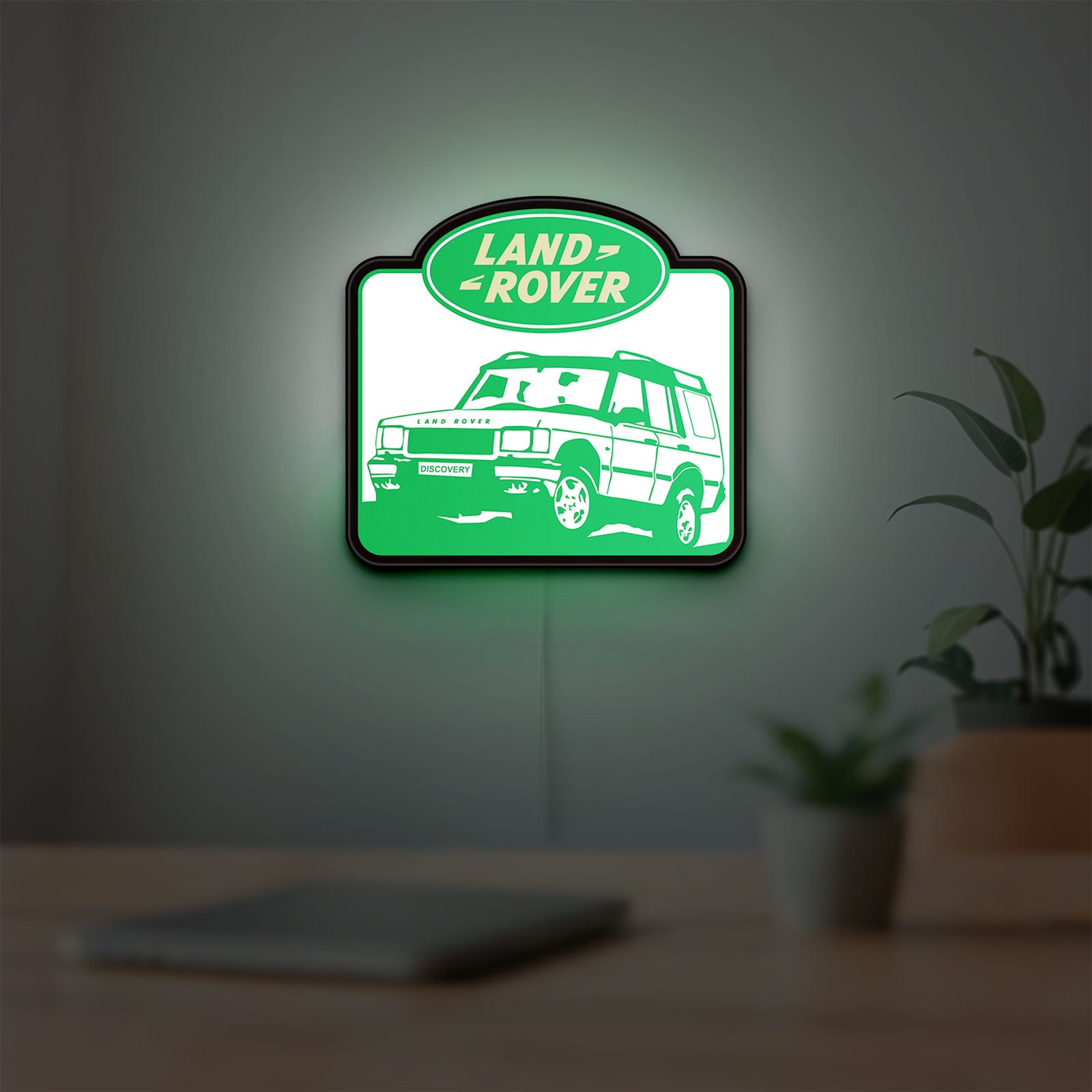 Land Rover Discovery LED lightbox hanging on a room wall with soft green light