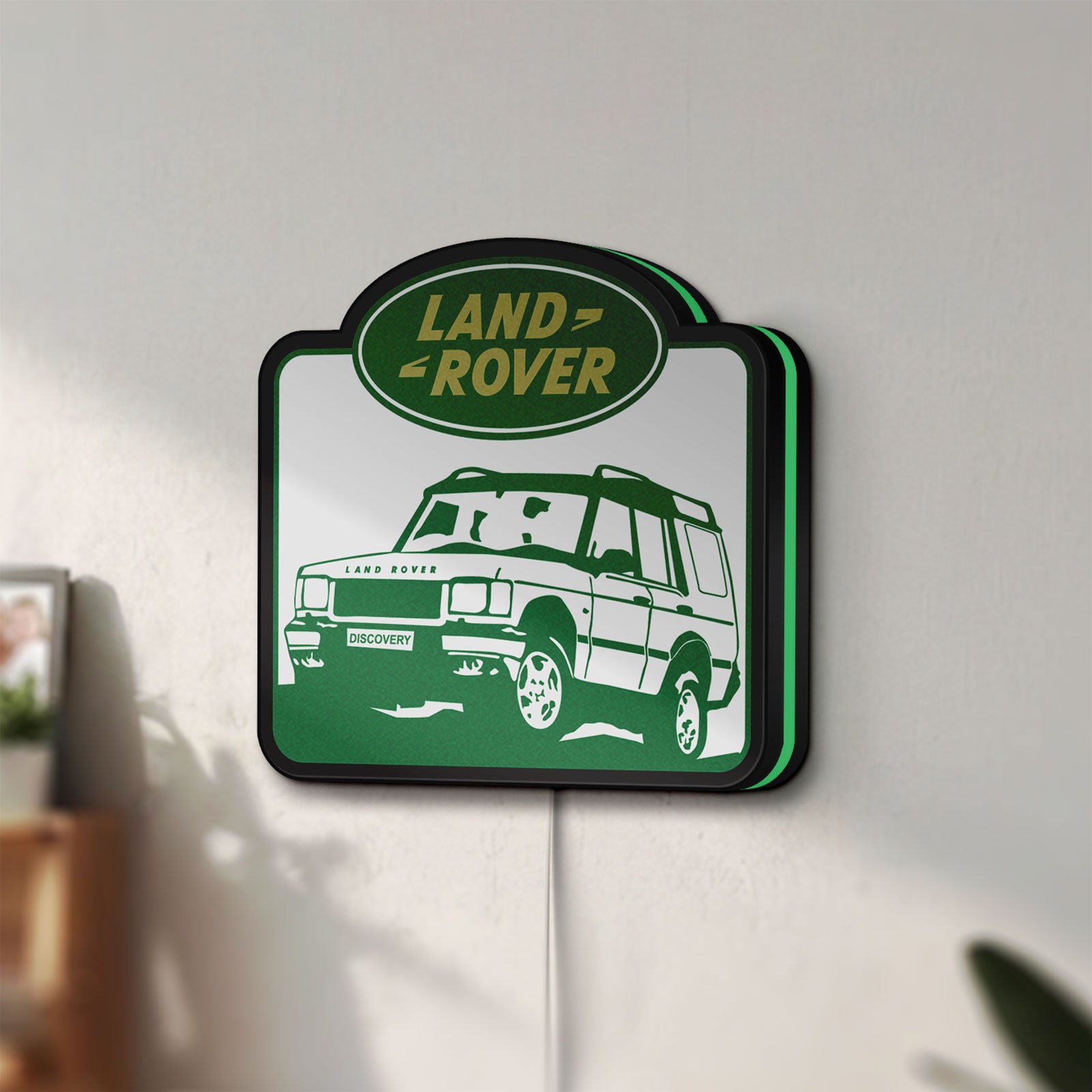 Unlit Land Rover Discovery LED lightbox mounted on a wall in daylight