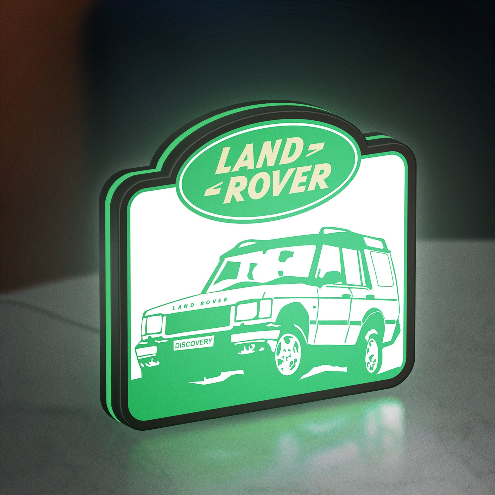 Land Rover Discovery LED lightbox standing on a desk from an angled side view with green glow