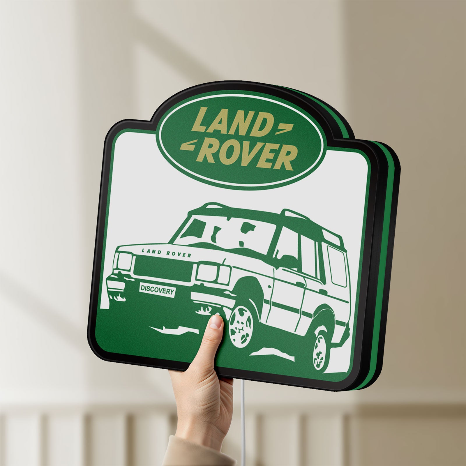 Unlit Land Rover Discovery LED lightbox held by hand to show size and details
