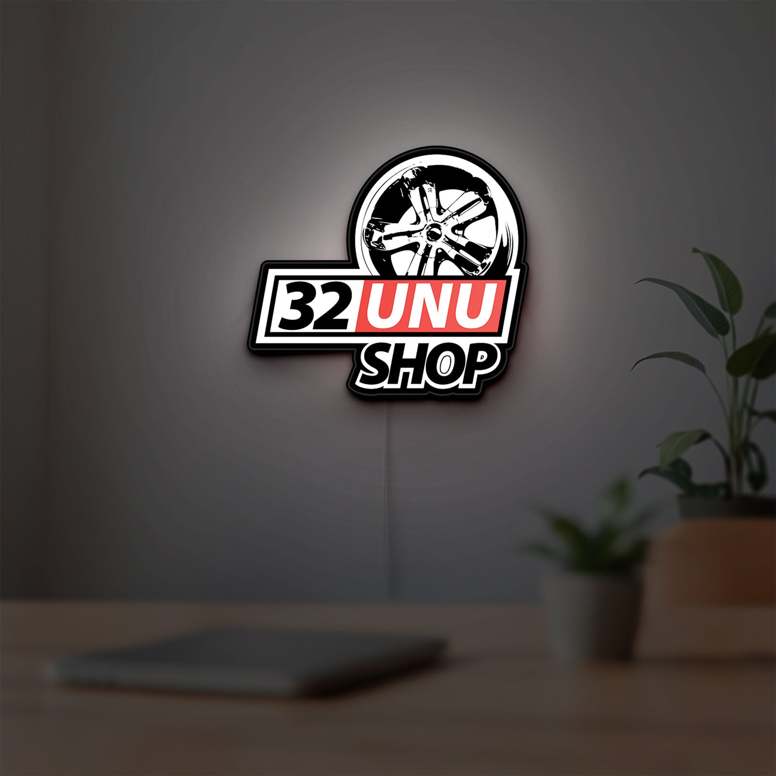 32UNU SHOP LED lightbox hanging on a room wall with soft white light