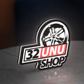 32UNU SHOP LED lightbox standing on a desk from an angled side view with white glow