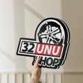 Unlit 32UNU SHOP LED lightbox held by hand to show size and details