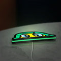 TURTLE ROSSI LED lightbox lying flat on a desk with green glow
