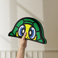 Unlit TURTLE ROSSI LED lightbox held by hand to show size and details