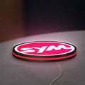 SYM Sanyang Scooters Motorcycle LED lightbox lying flat on a desk with red glow