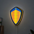 Koenigsegg LED lightbox hanging on a wall with yellow glow
