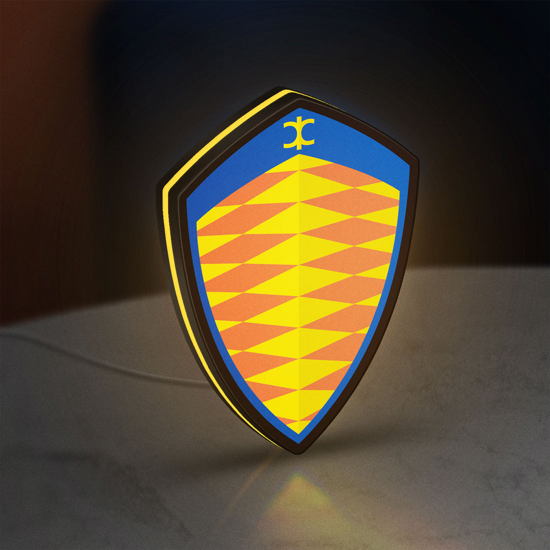 Koenigsegg LED lightbox hanging on a wall with yellow glow