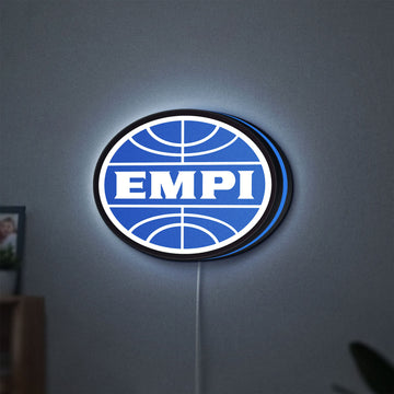 EMPI Volkswagen LED lightbox hanging on a wall with blue glow