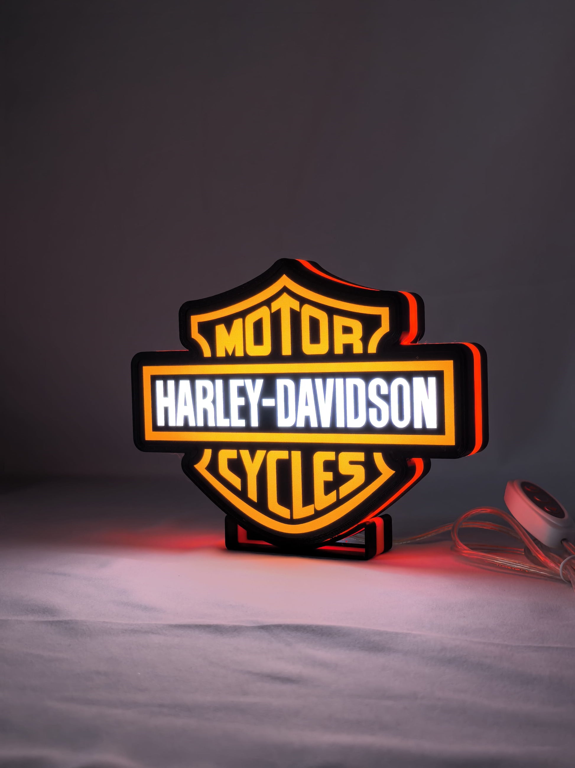 Illuminated angled view standing of Harley Davidson Illuminated Sign in 20cm, unique wall art for desk and room decor