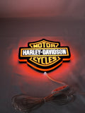 Illuminated flat lay angled view of Harley Davidson 3D LED Sign in 20cm, unique wall art for desk and room decor