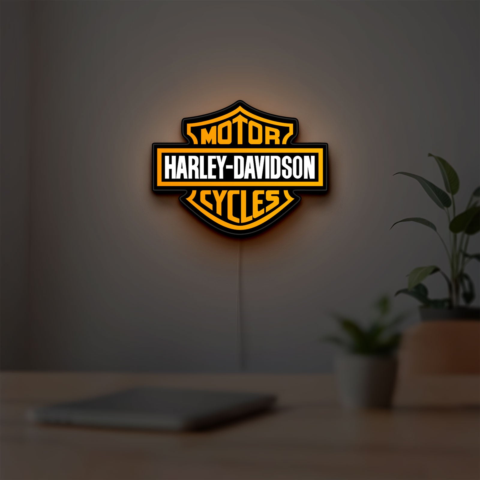 Harley Davidson LED lightbox hanging on a room wall with soft orange light