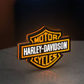 Harley Davidson LED lightbox standing on a desk from an angled side view with orange glow