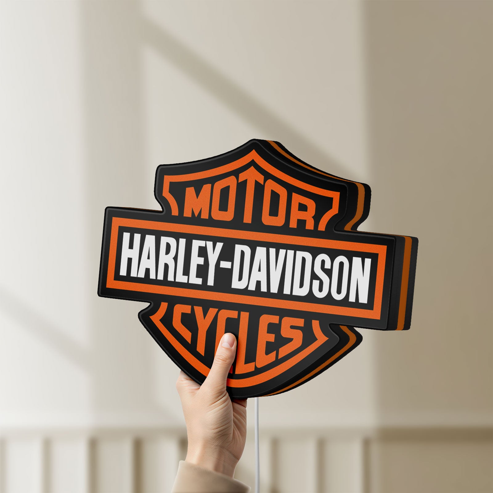 Unlit Harley Davidson LED lightbox held by hand to show size and details