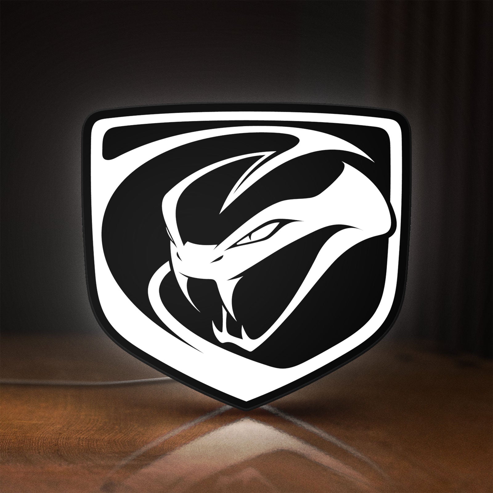 Front view of Dodge Viper LED lightbox sign glowing on a wooden desk