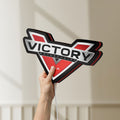 Unlit Victory Motorcycles LED lightbox held by hand to show size and details