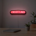 Freightliner Trucks LED lightbox hanging on a room wall with soft red light