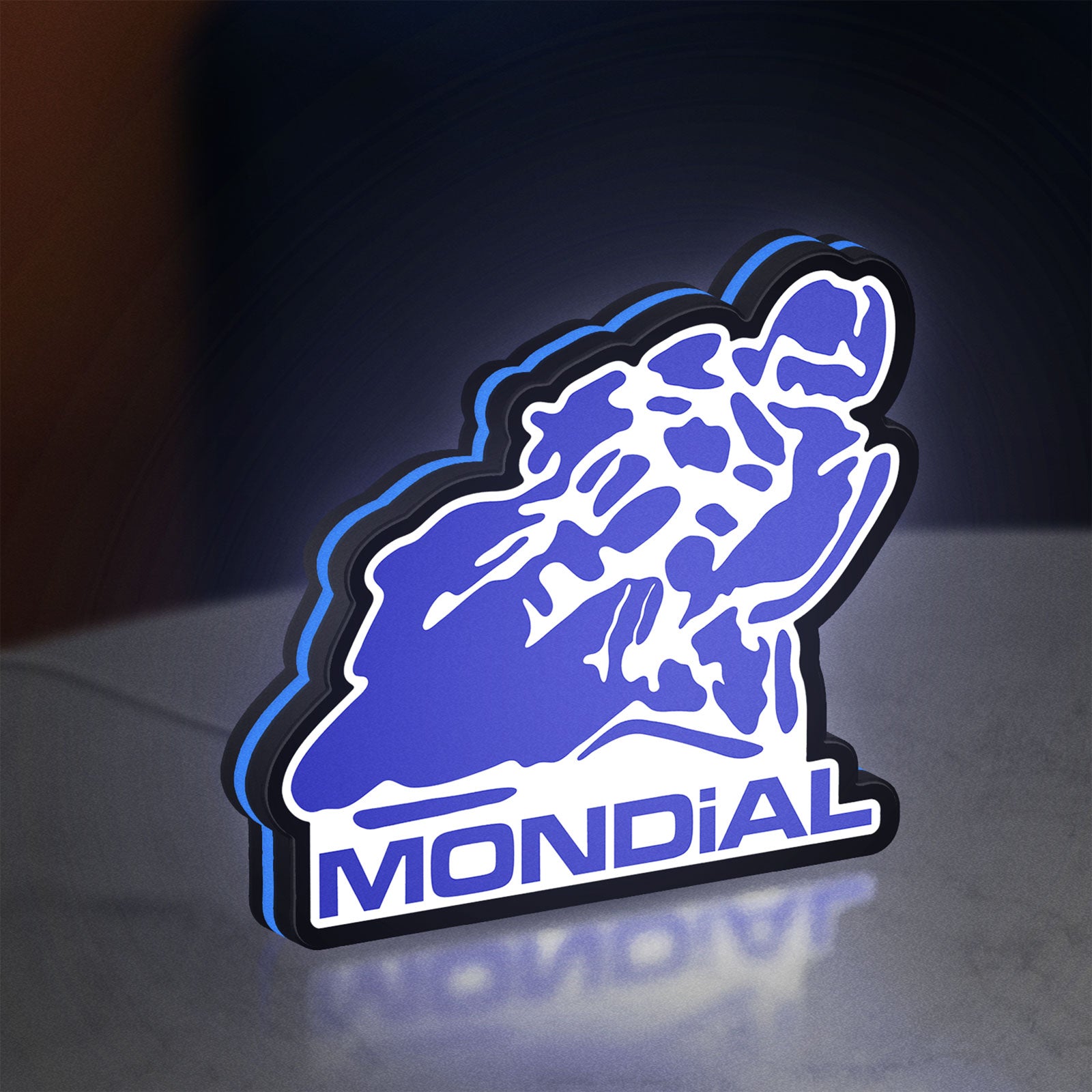Mondial Motorcycle LED lightbox standing on a desk from an angled side view with blue glow
