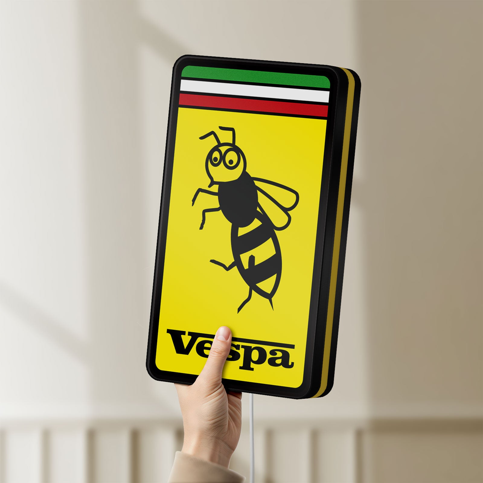 Unlit Vespa LED lightbox held by hand to show size and details