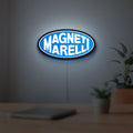 Magneti Marelli LED lightbox hanging on a room wall with soft blue light